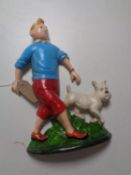 A cast iron Tin Tin door stop