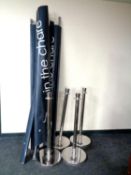 Five security bollards with partitions bearing advertisement