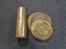 Four brass embossed plaques and a stick stand