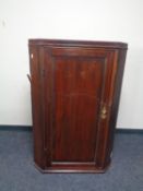 A late 18th/ early 19th century hanging corner cabinet.