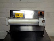 A Prisma Foods stainless steel commercial dough roller