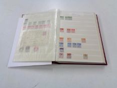 A stamp dealing album - GB Definitives, mixed quality used, lightly hinged mint and mint stamps.