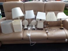 Nine assorted ceramic and brass table lamps with shades