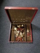 A canteen of Eastern brass teak handled cutlery.