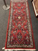 A Persian Saroukh rug 80 x 203 cm