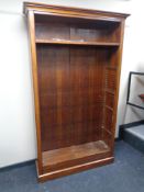 A set of pine and mahogany veneered open bookshelves.