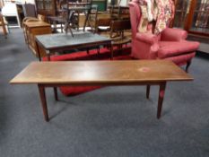 A mid 20th century Danish teak coffee table (adjustable height).