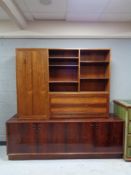 A mid 20th century Danish four door low sideboard together with another similar bookcase.