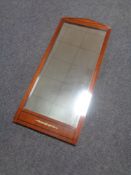 A mahogany hall mirror.