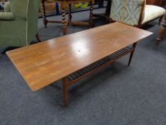 A mid 20th century teak rectangular coffee table with under shelf.