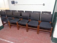 A set of twelve mid 20th century teak dining chairs upholstered in a striped fabric