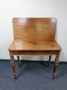 A 19th century mahogany turnover topped tea table.