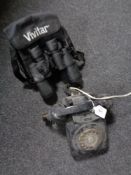 A Bakelite telephone together with a set of Vivitar binoculars in case.
