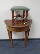A D-shaped table, fitted a drawer, together with a green dralon upholstered footstool.