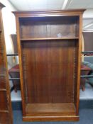 A set of pine and mahogany veneered open bookshelves.