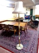 A brass and onyx standard lamp with shade