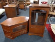 A contemporary audio cabinet and TV stand in a walnut finish.