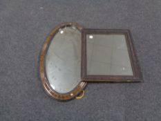 A 19th century carved framed wall mirror together with a further oval framed bevel edged mirror.