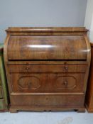 A 19th century mahogany cylinder bureau.