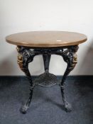 A cast iron Britannia bar table with copper top.