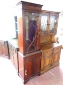 A Regency style single door bookcase fitted cupboard beneath