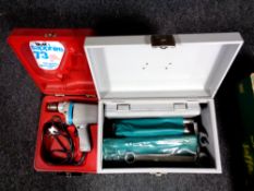 A metal box containing router bits, spanner set, socket set etc,