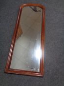 An antique mahogany arch topped hall mirror.