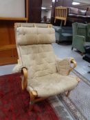 A beech framed high back 'Pernilla' armchair by Bruno Mathsson for Dux.