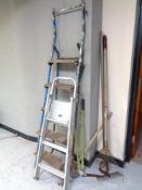 A set of aluminium folding steps together with a further pair of wooden and metal folding steps and