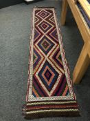 A Suzni kilim runner 313 x 68 cm.