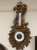 An early 20th century heavily carved nautical themed barometer by L. Meumann.