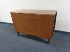 A mahogany drop leaf table
