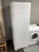 An Indesit upright fridge