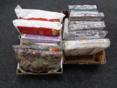 Two boxes containing new duvet sets, electric blankets etc.