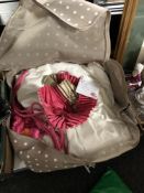 A bag containing a pair of pink silk lined curtains, 74 inches wide, 90 inches drop.