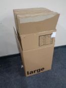 A box containing ten folded cardboard storage boxes