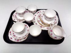 A tray containing a 20 piece Royal Vale part tea set.