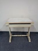 A continental painted and gilt single drawer side table