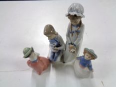 Four Nao figures of girls