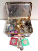 A tin containing crowns,