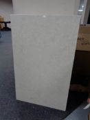 A rectangular cream marble table top