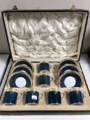 A cased twelve piece Royal Worcester cobalt blue and gilt porcelain coffee service