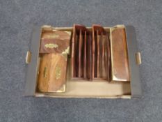 A box containing three brass mounted hardwood storage boxes and two similar brass inlaid letter