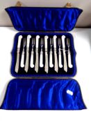 A set of twelve late Victorian silver fish knives and forks with mother of pearl pistol grips in a