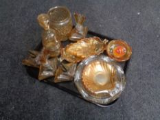 A tray containing a quantity of petrol glass