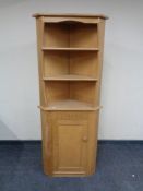A blonde oak corner unit