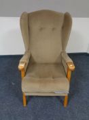 A 20th century wingback armchair