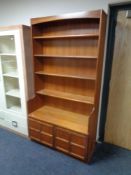 A teak open bookcase,