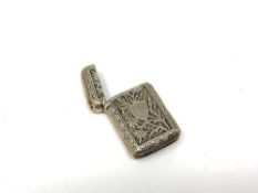 A highly ornate silver vesta case, Chester 1887.