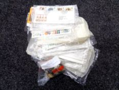 A box containing a small quantity of European coinage and First Day covers